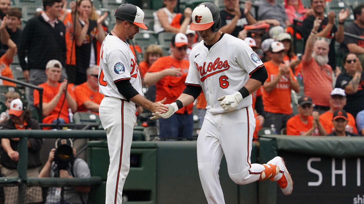 Baltimore Orioles designated hitter Ryan Mountcastle (6) greeted by coach Buck Britton (46) following his solo home run in the third inning against the Tampa Bay Rays at Oriole Park at Camden Yards.