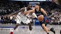 Dallas Mavericks guard Ryan Nembhard (9) drives to the basket past Denver Nuggets guard Tim Hardaway Jr. (10) during the second half at the American Airlines Center.