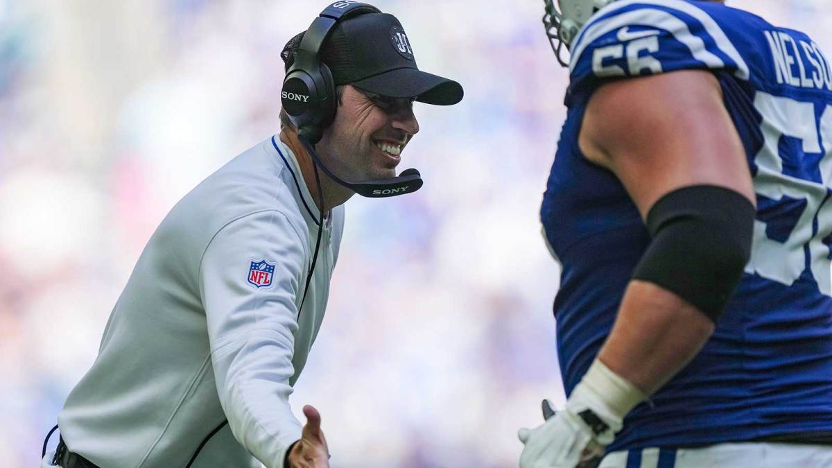 Indianapolis Colts head coach Shane Steichen high-fives Indianapolis Colts guard Quenton Nelson.