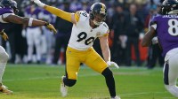 Pittsburgh Steelers linebacker T.J. Watt (90) chases down Baltimore Ravens quarterback Lamar Jackson (8) during the first half at M&T Bank Stadium.