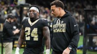 New Orleans Saints running back Devin Neal (24) is walked off of the field after an injury during the second quarter against the Carolina Panthers at Caesars Superdome