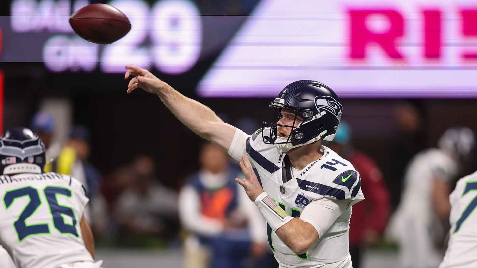 Seattle Seahawks quarterback Sam Darnold (14) throws a pass against the Atlanta Falcons in the first quarter at Mercedes-Benz Stadium.