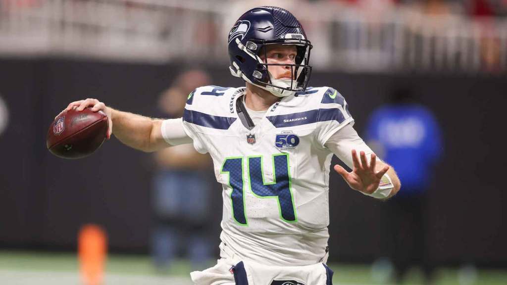 Seattle Seahawks quarterback Sam Darnold (14) throws a pass against the Atlanta Falcons in the third quarter at Mercedes-Benz Stadium.