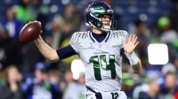 Seattle Seahawks quarterback Sam Darnold (14) warms up before the game against the Los Angeles Rams at Lumen Field.