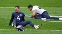 Denver Broncos quarterback Sam Ehlinger (4) stretches during practice at the Hanbury Manor.