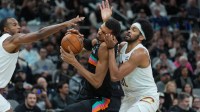 San Antonio Spurs forward Victor Wembanyama (1) drives against Cleveland Cavaliers center Jarrett Allen (31) in the second half at Frost Bank Center.