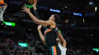 San Antonio Spurs forward Victor Wembanyama (1) shoots in front of Cleveland Cavaliers center Jarrett Allen (31) in the second half at Frost Bank Center.
