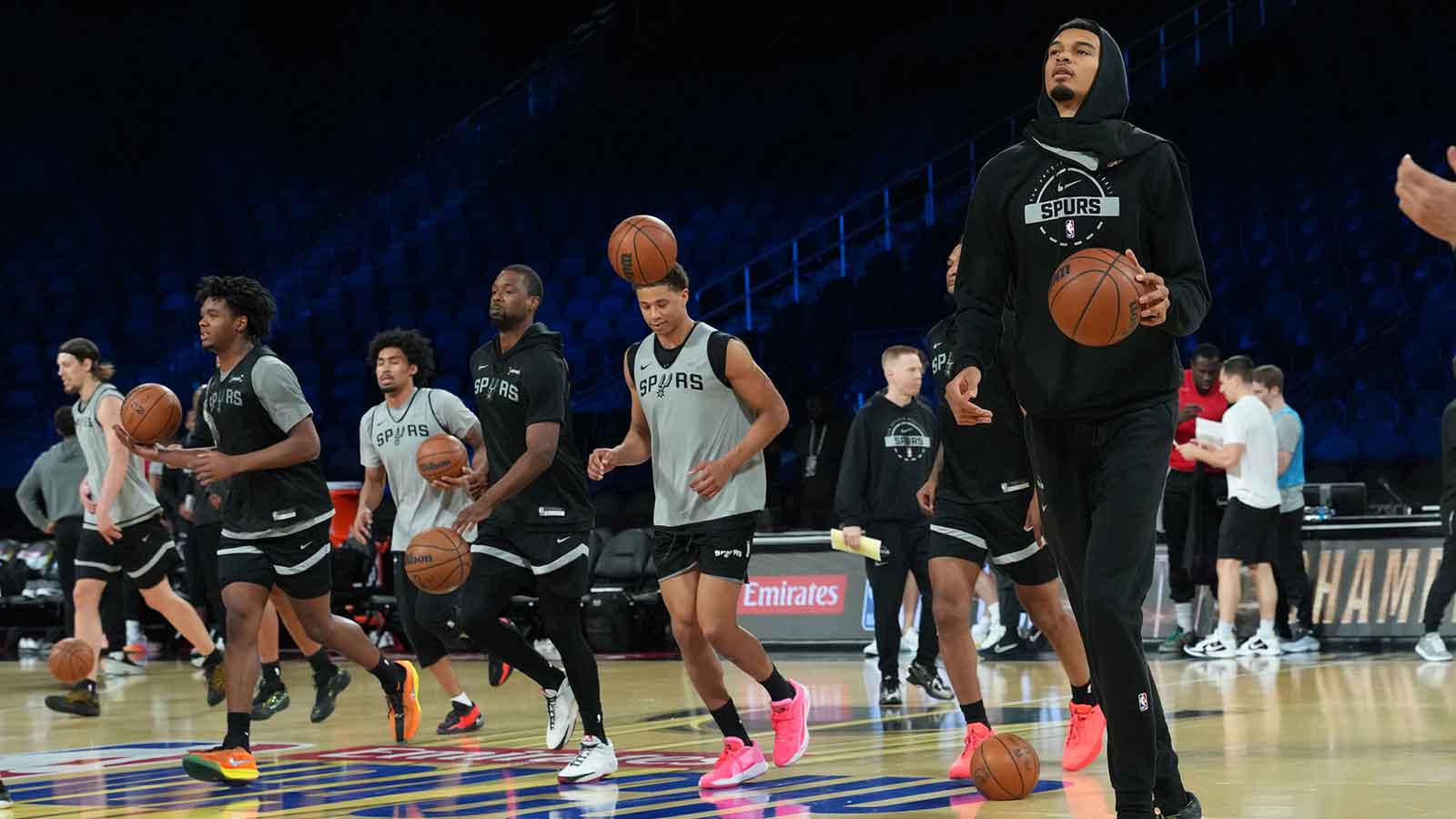 San Antonio Spurs forward Victor Wembanyama (right) dribbles the ball during practice prior to the Emirates NBA Cup championship at the T-Mobile Arena.
