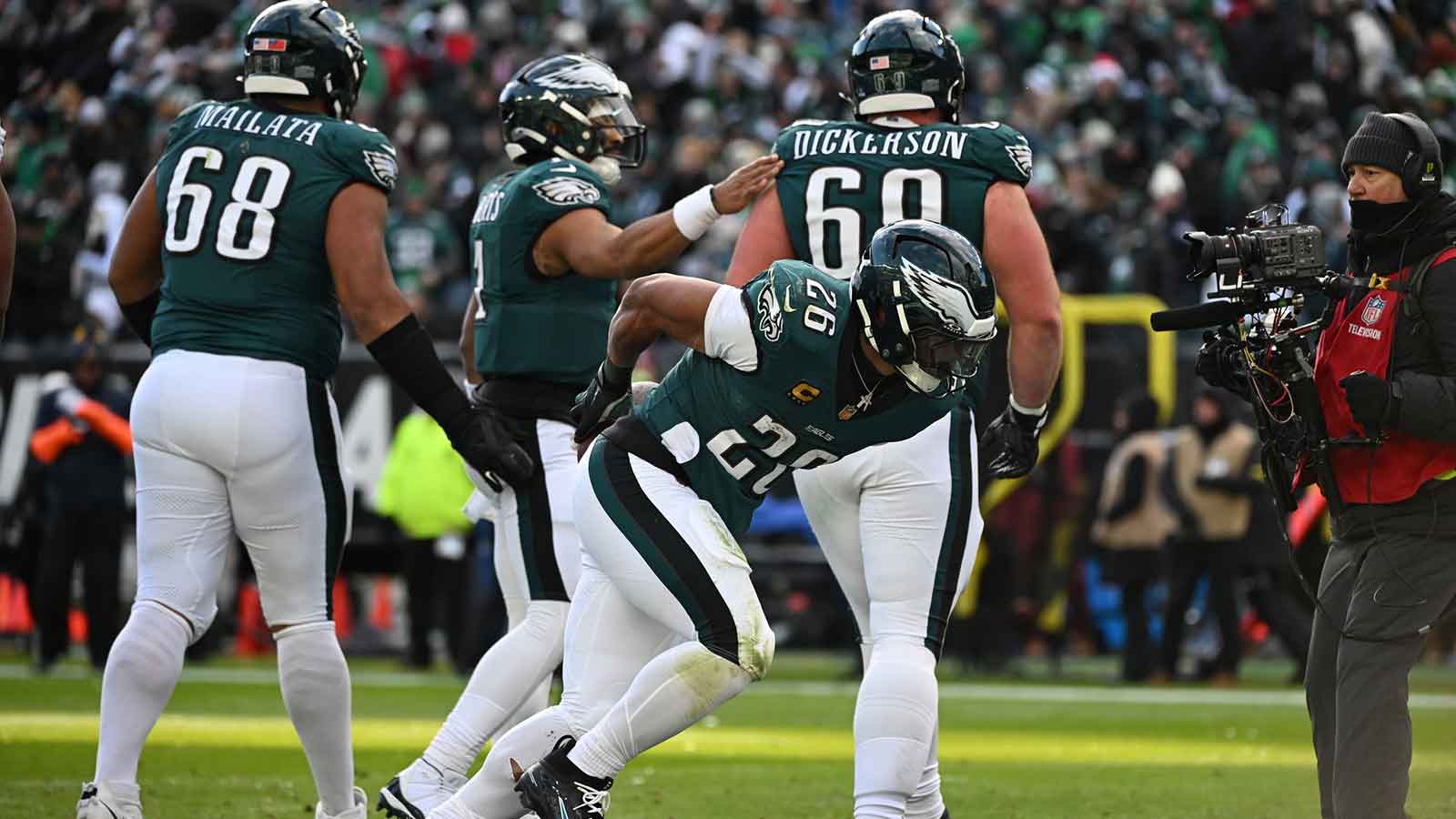 Philadelphia Eagles running back Saquon Barkley (26) celebrates with teammates after scoring a touchdown in the second quarter against the Las Vegas Raiders at Lincoln Financial Field.