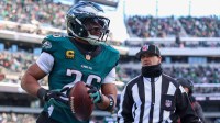 Philadelphia Eagles running back Saquon Barkley (26) reacts after scoring a touchdown against the Las Vegas Raiders during the second quarter at Lincoln Financial Field.