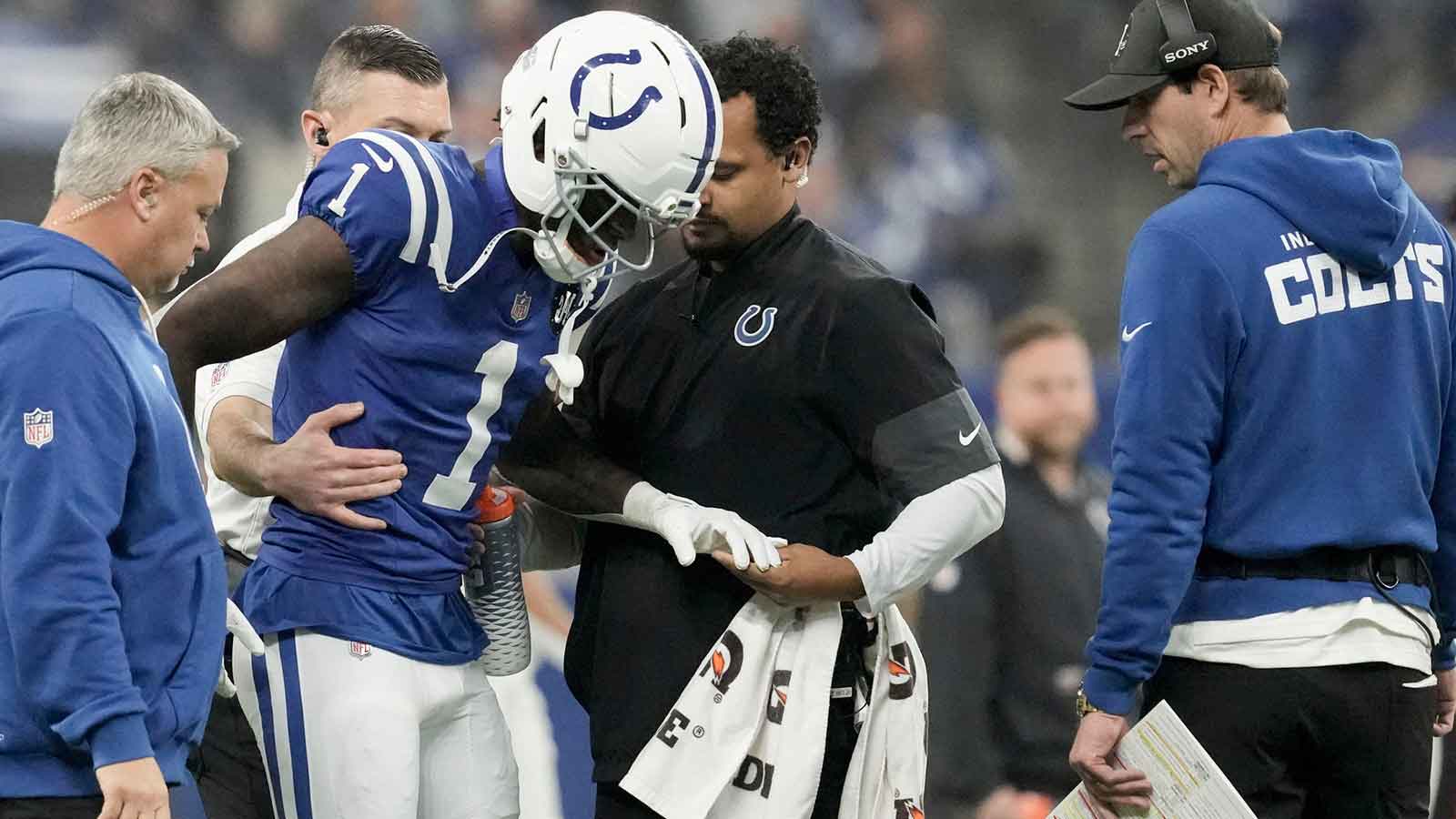 Indianapolis Colts cornerback Sauce Gardner (1) is helped off the field following an injury Sunday, Nov. 30, 2025, during a game against the Houston Texans at Lucas Oil Stadium in Indianapolis.