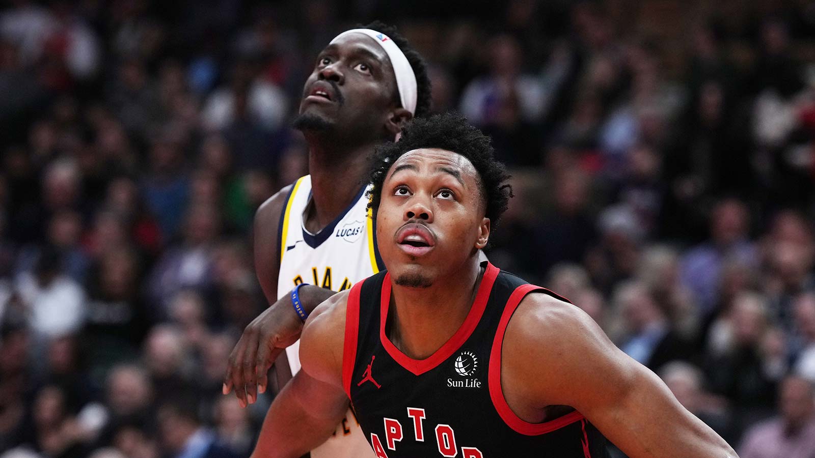 Indiana Pacers forward Pascal Siakam (43) battles for the round with Toronto Raptors forward Scottie Barnes (4) during the second quarter at Scotiabank Arena.