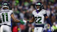 Seattle Seahawks wide receiver Rashid Shaheed (22) reacts with wide receiver Jaxon Smith-Njigba (11) in the first half against the Los Angeles Rams at Lumen Field.