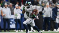 Seattle Seahawks running back Kenneth Walker III (9) runs for a touchdown against the Los Angeles Rams in the second half at Lumen Field.