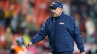 Denver Broncos head coach Sean Payton looks on during warmups prior to the game against the Washington Commanders at Northwest Stadium.