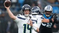 Seattle Seahawks quarterback Sam Darnold (14) throws a pass against the Carolina Panthers during the fourth quarter at Bank of America Stadium.