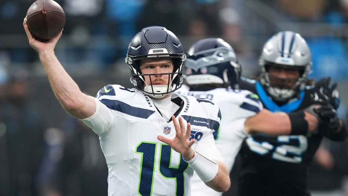 Seattle Seahawks quarterback Sam Darnold (14) throws a pass against the Carolina Panthers during the fourth quarter at Bank of America Stadium.