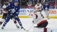 Ottawa Senators goaltender Linus Ullmark (35) makes a glove save as Toronto Maple Leafs forward Auston Matthews (34) closes in during the first period at Scotiabank Arena.