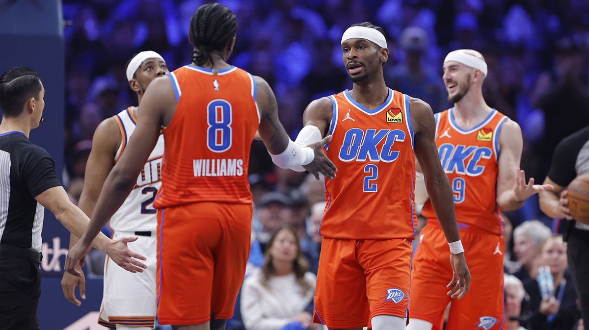 Oklahoma City Thunder guard Shai Gilgeous-Alexander (2) and guard Jalen Williams (8) high five after a play against the Phoenix Suns during the second quarter at Paycom Center.