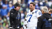 Indianapolis Colts head coach Shane Steichen, left, talks with quarterback Philip Rivers (17) during a second quarter timeout against the Seattle Seahawks at Lumen Field.