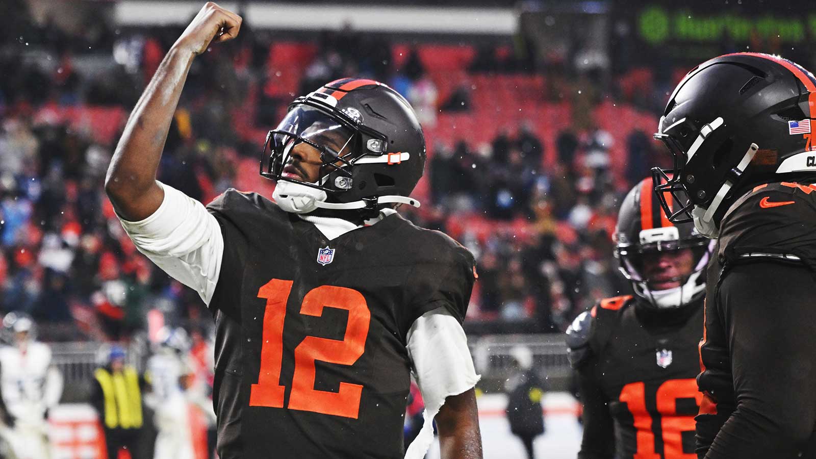 Cleveland Browns quarterback Shedeur Sanders (12) celebrates after scoring a touchdown against the Tennessee Titans during the fourth quarter at Huntington Bank Field. 