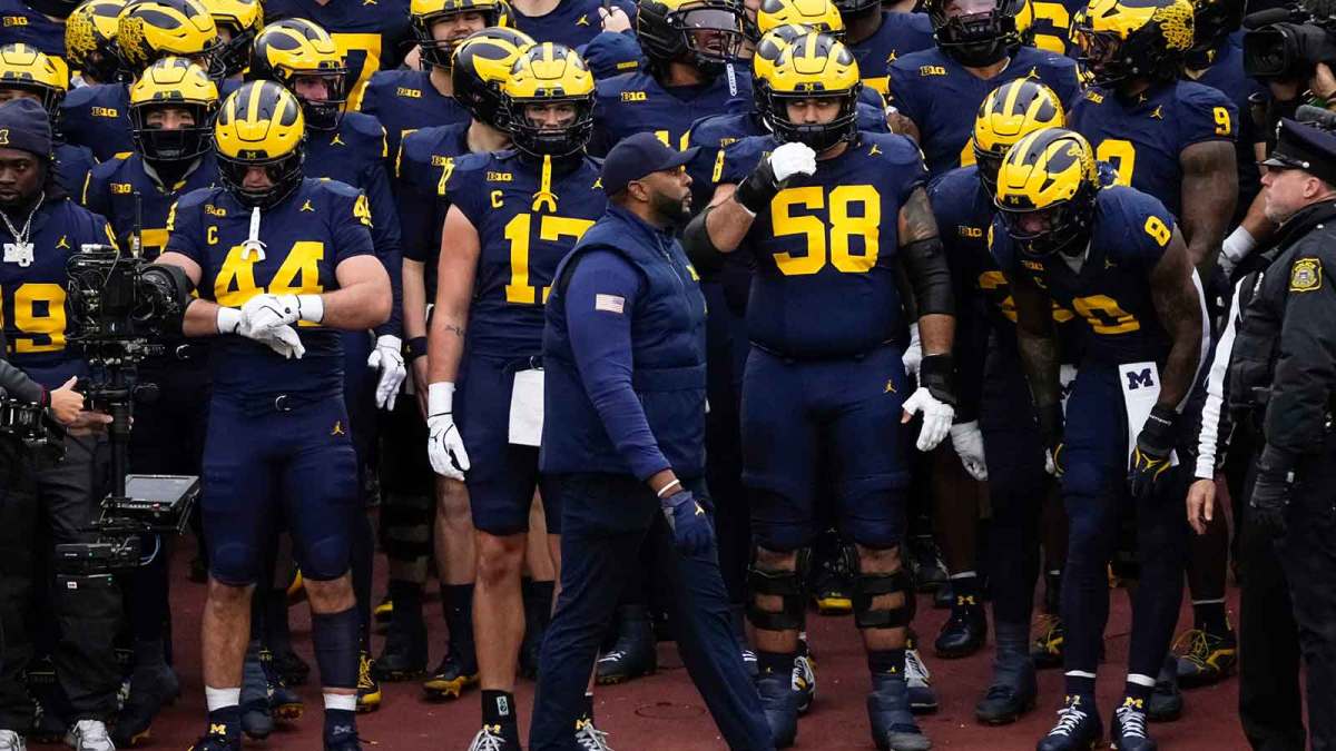Michigan Wolverines head coach Sherrone Moore prepares to lead his team onto the field for the NCAA football game against the Ohio State Buckeyes at Michigan Stadium in Ann Arbor, Mich. on Nov. 29, 2025. Ohio State won 27-9.