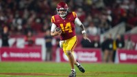 Southern California Trojans quarterback Jayden Maiava (14) carries the ball against the UCLA Bruins in the first half at United Airlines Field at Los Angeles Memorial Coliseum