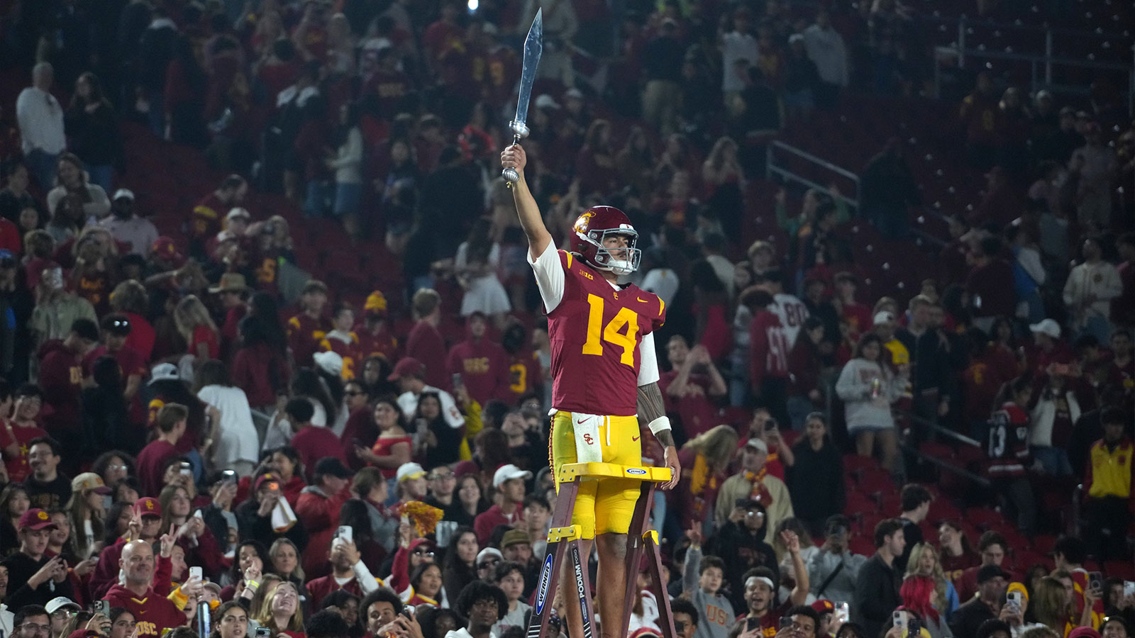 Southern California Trojans quarterback Jayden Maiava (14) leads the Spirit of Troy marching band in a rendition of Tribute to Troy after teh game against the UCLA Bruins at United Airlines Field at Los Angeles Memorial Coliseum