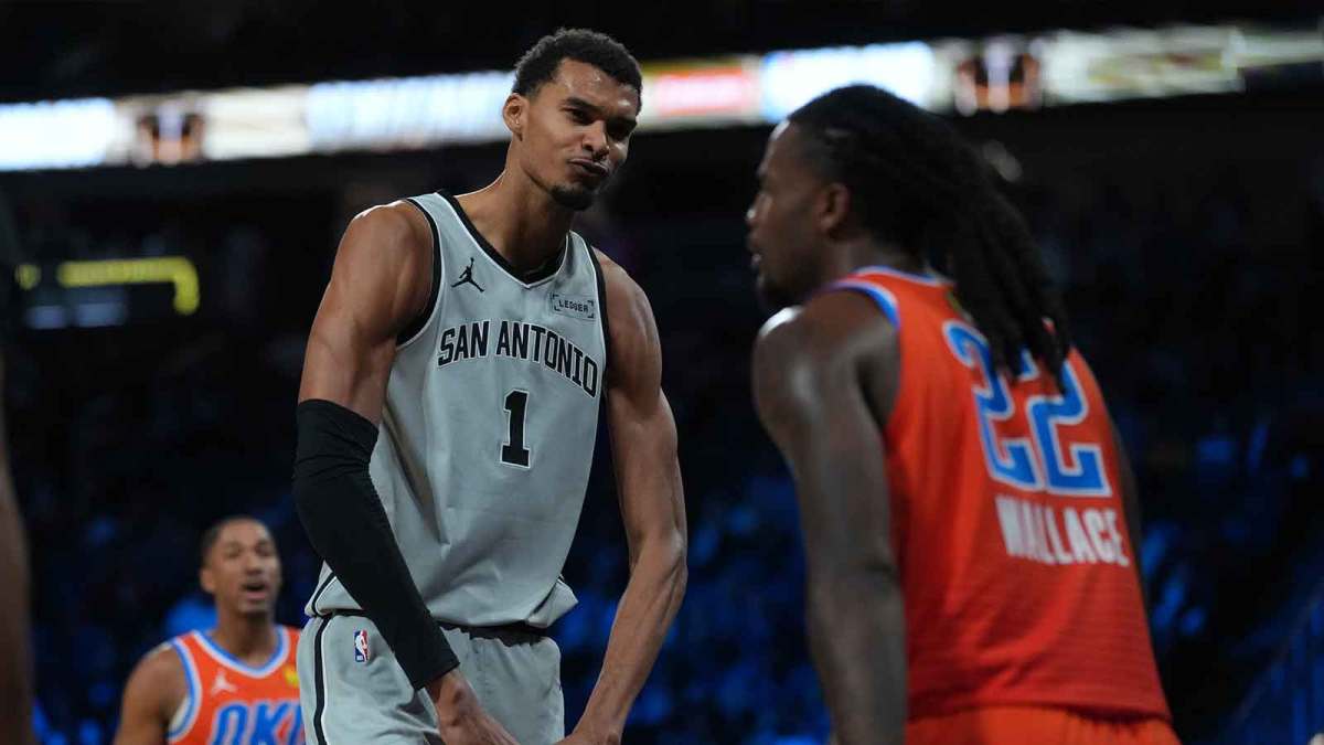 Spurs forward Victor Wembanyama (1) flexes in front of Oklahoma City Thunder guard Cason Wallace (22) during the third quarter at T-Mobile Arena
