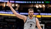 San Antonio Spurs center/forward Luke Kornet (7) waves to the crowd as heads in for halftime against the New Orleans Pelicans during the first half at Smoothie King Center.