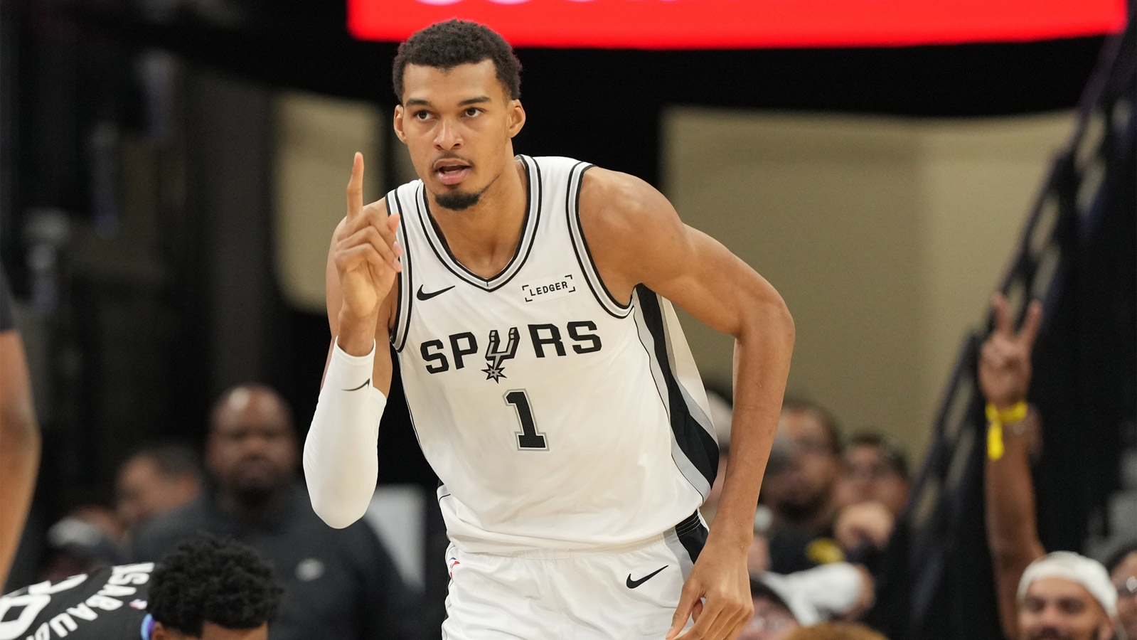 Spurs forward Victor Wembanyama (1) reacts after scoring during the first half against the Utah Jazz at Frost Bank Center