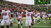 Indiana Hoosiers defensive lineman Stephen Daley (8), tight end Riley Nowakowski (37) and offensive lineman Carter Smith (65) celebrate on the field after defeating the Oregon Ducks by the score of 30-20 at Autzen Stadium. Mandatory Credit: Troy Wayrynen-Imagn Images at Autzen Stadium. Mandatory Credit: Troy Wayrynen-Imagn Images