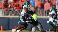 Tulane Green Wave running back Javin Gordon (23) runs the ball as Mississippi Rebels defensive back Kapena Gushiken (14) makes the tackle during the fourth quarter at Vaught-Hemingway Stadium.