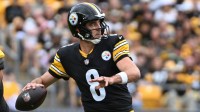 Pittsburgh Steelers quarterback Aaron Rodgers (8) looks to pass against the Cleveland Browns during the second quarter at Acrisure Stadium.