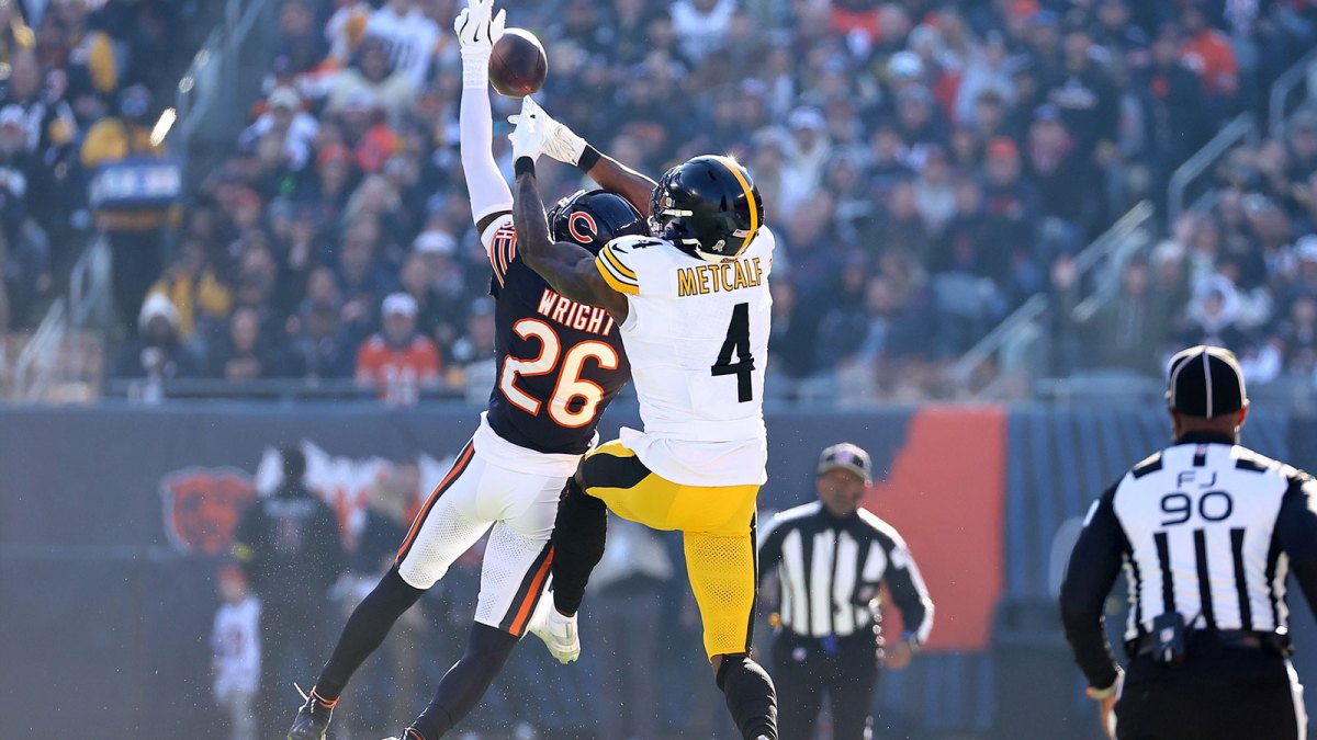 Chicago Bears cornerback Nahshon Wright (26) intercepts a pass against Pittsburgh Steelers wide receiver DK Metcalf (4) during the first half at Soldier Field.