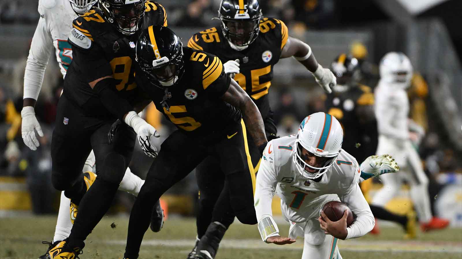 Pittsburgh Steelers cornerback Jalen Ramsey (5) sacks Miami Dolphins quarterback Tua Tagovailoa (1) in the third quarter at Acrisure Stadium.