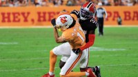 Atlanta Falcons cornerback Cobee Bryant (37) tackles Tampa Bay Buccaneers wide receiver Jalen McMillan (11) during the second quarter at Raymond James Stadium.