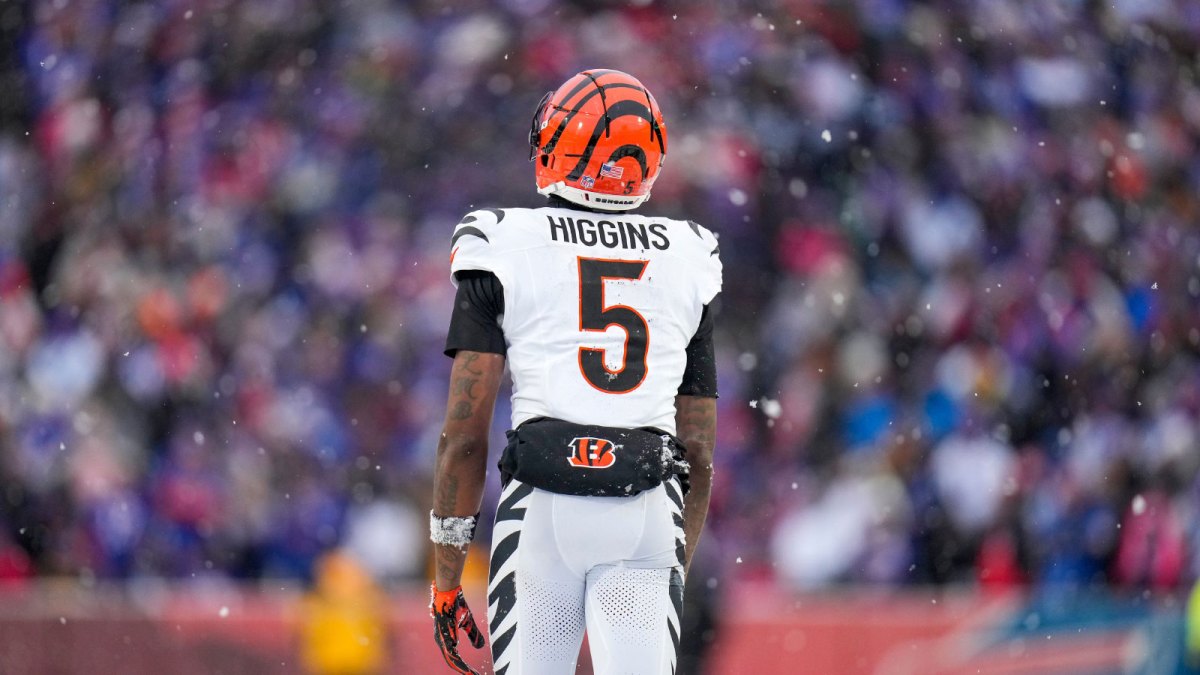 Cincinnati Bengals wide receiver Tee Higgins (5) walks for the sideline after hitting his head for a second time in the fourth quarter of the NFL Week 14 game between the Buffalo Bills and the Cincinnati Bengals at Highmark Stadium