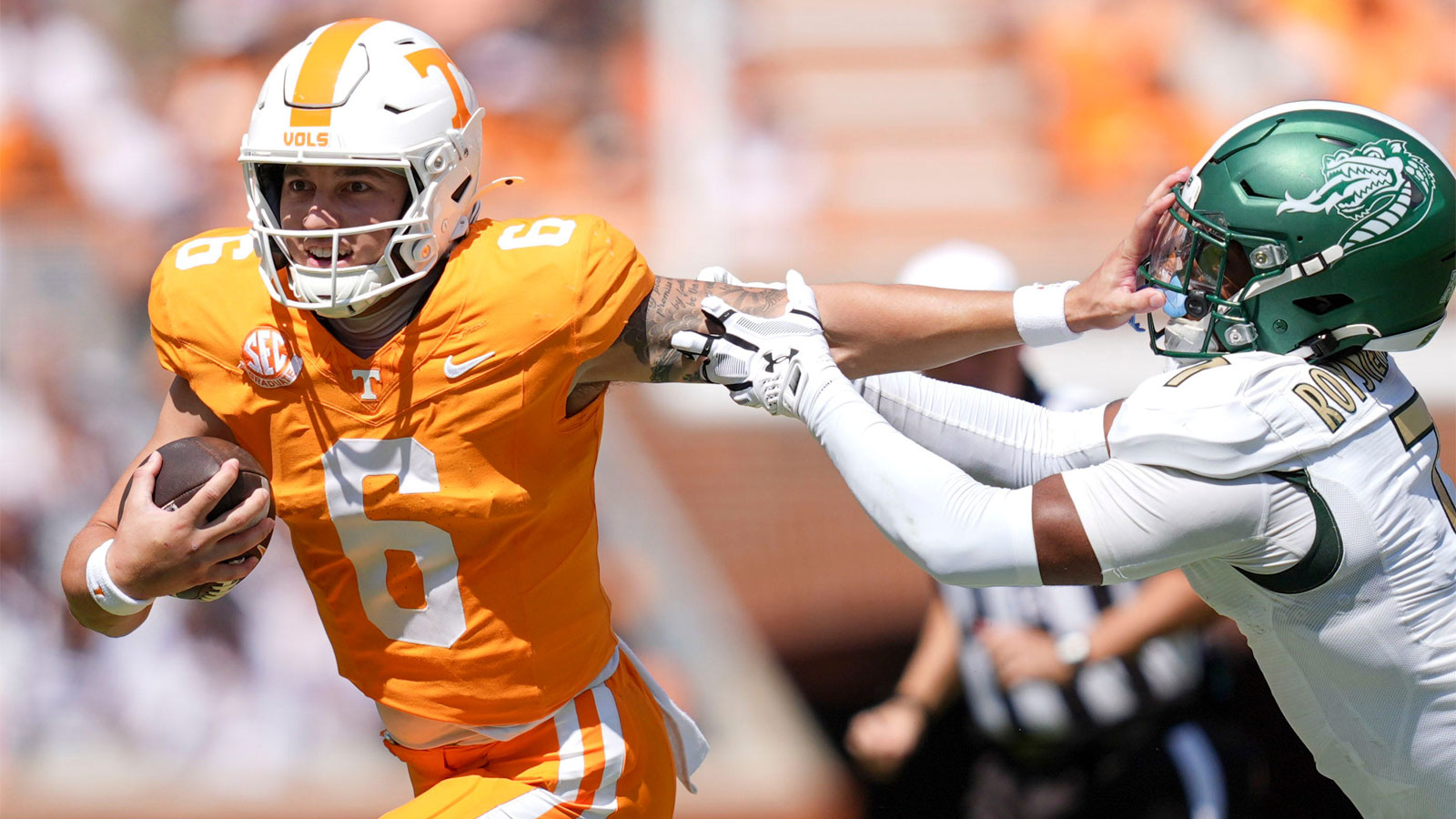 Tennessee quarterback Joey Aguilar (6) holds off UAB safety Pierre Royster (7) during an NCAA college football game on September 20, 2025, in Knoxville, Tennessee.