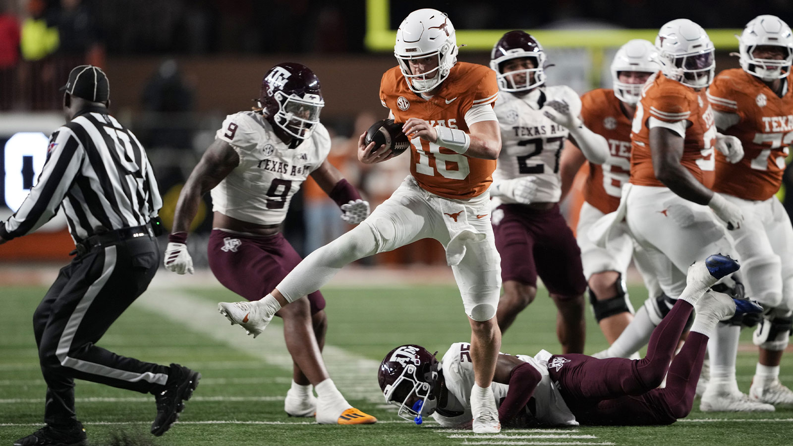 Longhorns quarterback Arch Manning keeps the ball and runs for a touchdown during the second half against the Texas A&M Aggies at Darrell K Royal-Texas Memorial Stadium. 