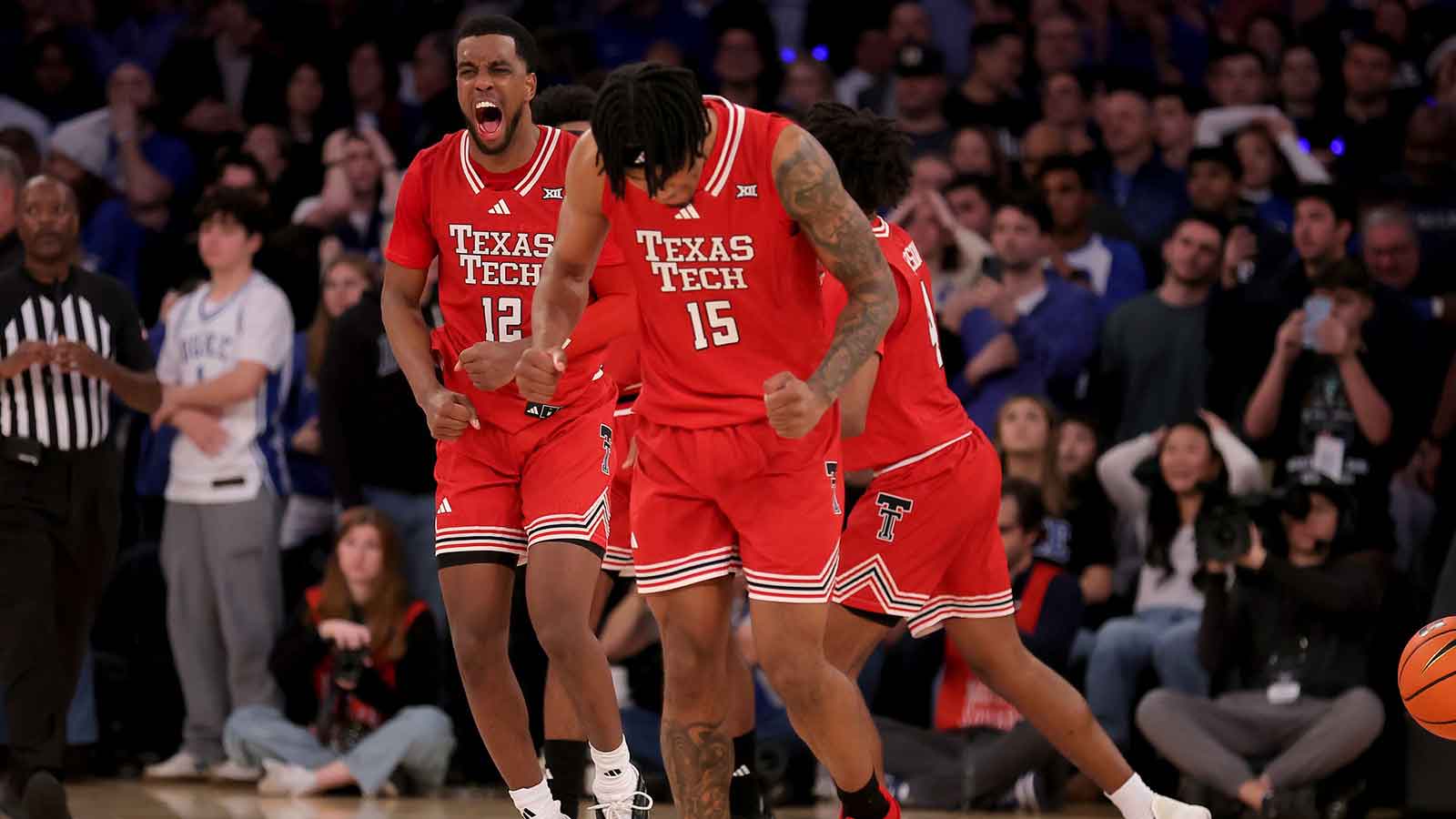 Texas Tech Red Raiders guard Donovan Atwell (12) and forward JT Toppin (15) celebrate after defeating the Duke Blue Devils at Madison Square Garden. 