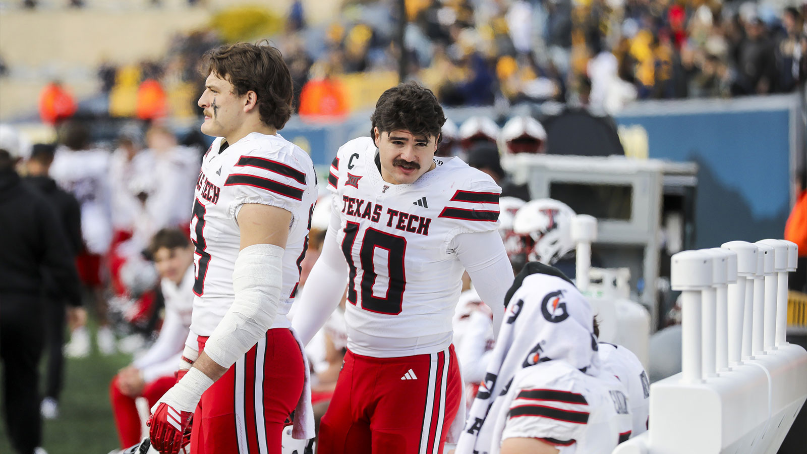 Texas Tech Red Raiders linebacker Jacob Rodriguez (10) talks with Texas Tech Red Raiders quarterback Behren Morton (2) and Texas Tech Red Raiders wide receiver Coy Eakin (3) during the fourth quarter against the West Virginia Mountaineers at Milan Puskar Stadium