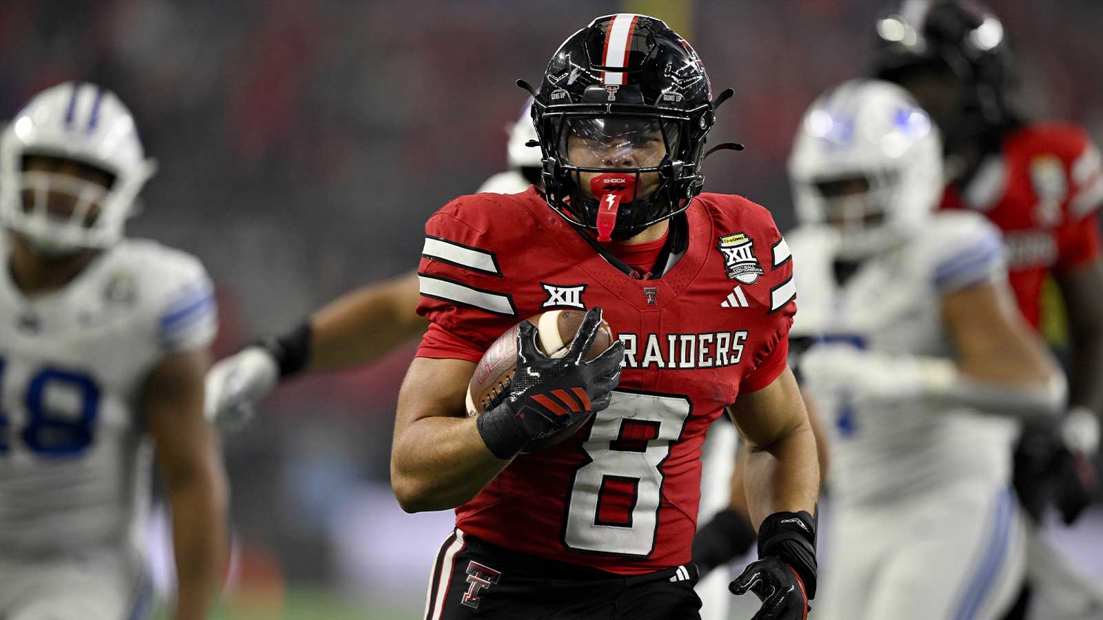 Texas Tech Red Raiders running back Cameron Dickey (8) runs with the ball and scores a touchdown against the BYU Cougars during the second half at AT&T Stadium.