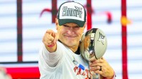 Texas Tech Red Raiders head coach Joey McGuire celebrates with the Big 12 Championship trophy after the game against the BYU Cougars at AT&T Stadium.