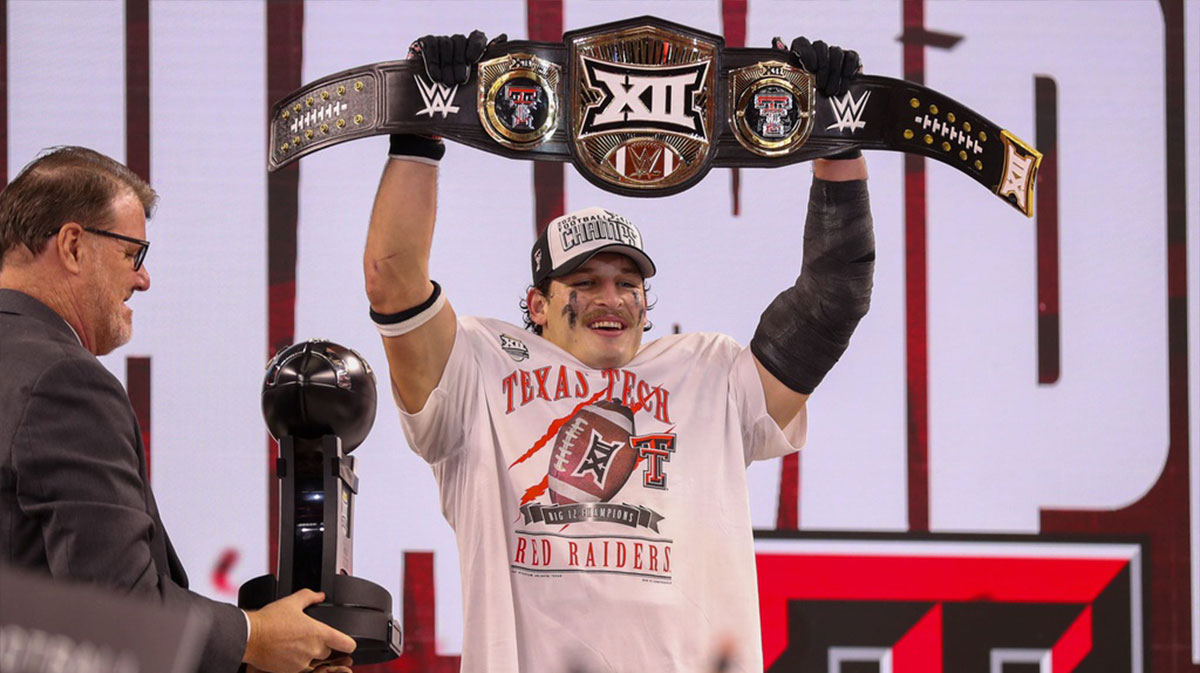 Texas Tech's Ben Roberts lifts the title belt after being named most outstanding player of the Big 12 Conference championship football game, Saturday, Nov. 6, 2025, at AT&T Stadium in Arlington.