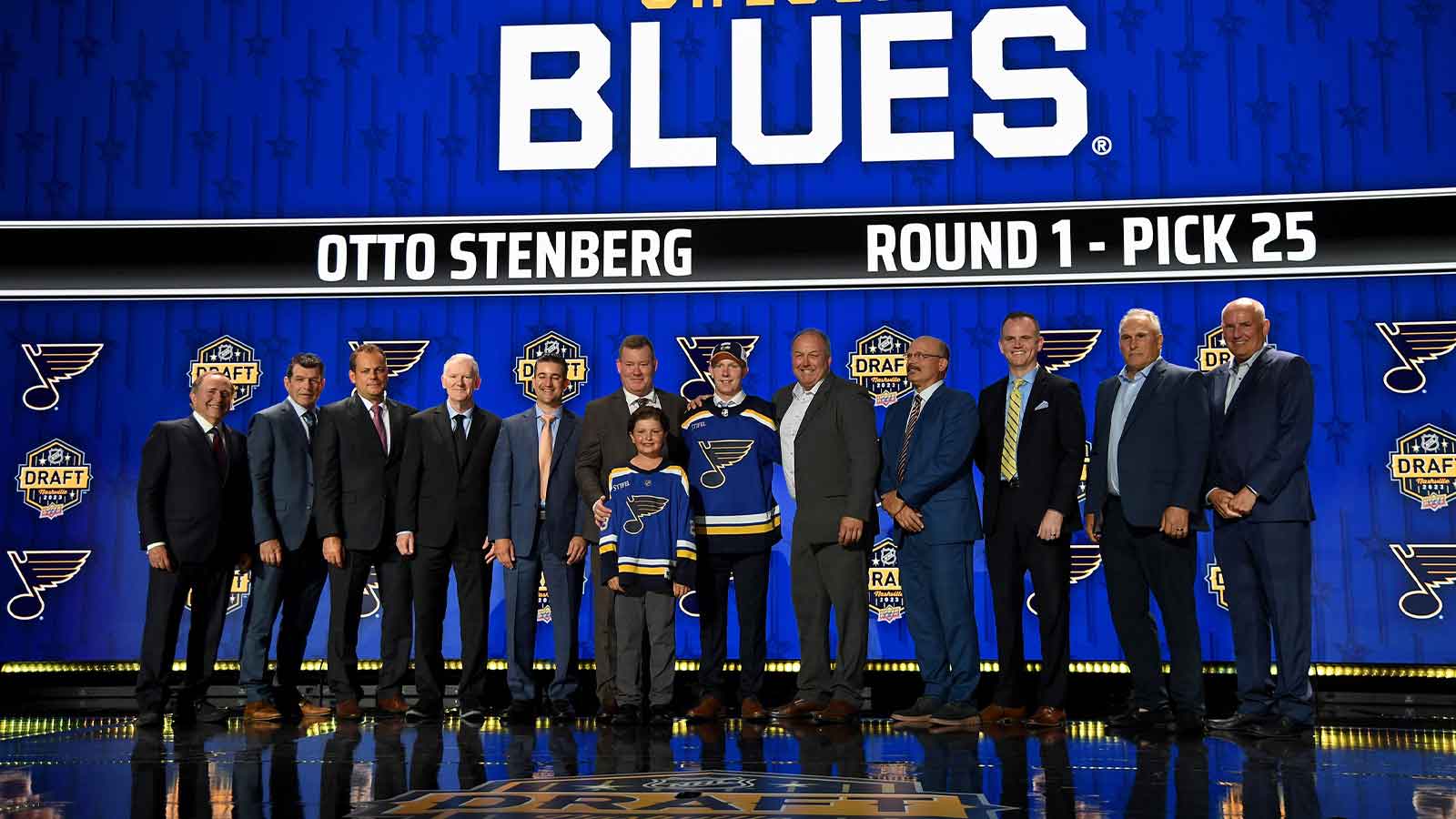 St. Louis Blues draft pick Otto Stenberg stands with Blues staff after being selected with the twenty fifth pick in round one of the 2023 NHL Draft at Bridgestone Arena.