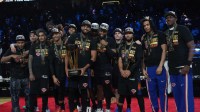 The New York Knicks pose for a photograph after winning the Emirates NBA Cup Final at T-Mobile Arena.