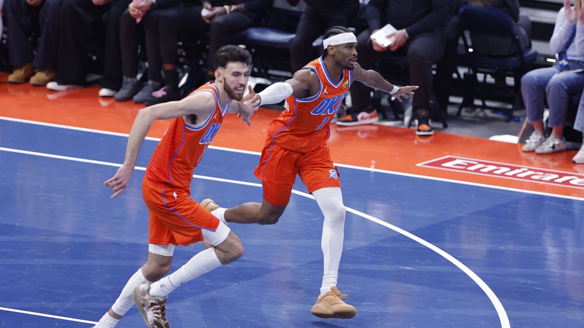 Oklahoma City Thunder guard Shai Gilgeous-Alexander (2) and center Chet Holmgren (7) celebrate after scoring against the Phoenix Suns during the third quarter at Paycom Center.