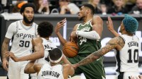 Milwaukee Bucks forward Giannis Antetokounmpo (34) loses the ball while driving to the basket against San Antonio Spurs center Victor Wembanyama (1) and forward Jeremy Sochan (10) during the second half at Frost Bank Center.