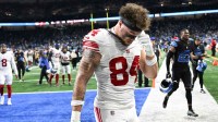 New York Giants tight end Theo Johnson (84) walks the field after the game against the Detroit Lions at Ford Field.